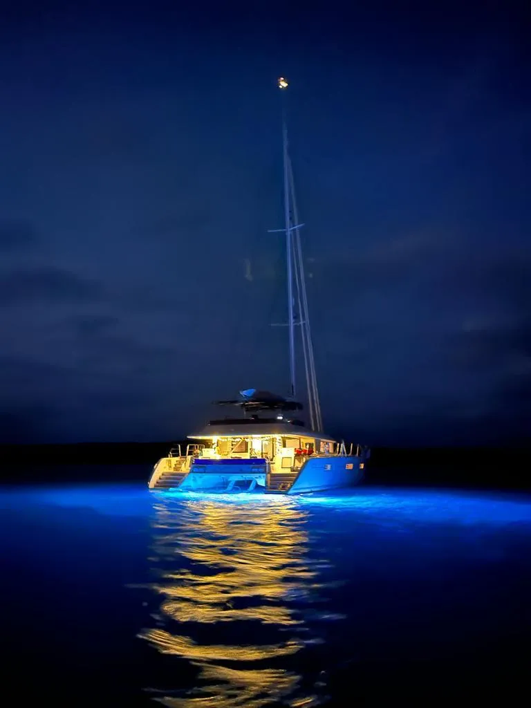 Slide: The Image of Lagoon 620 yacht illuminated at night, 2015 model. - 4