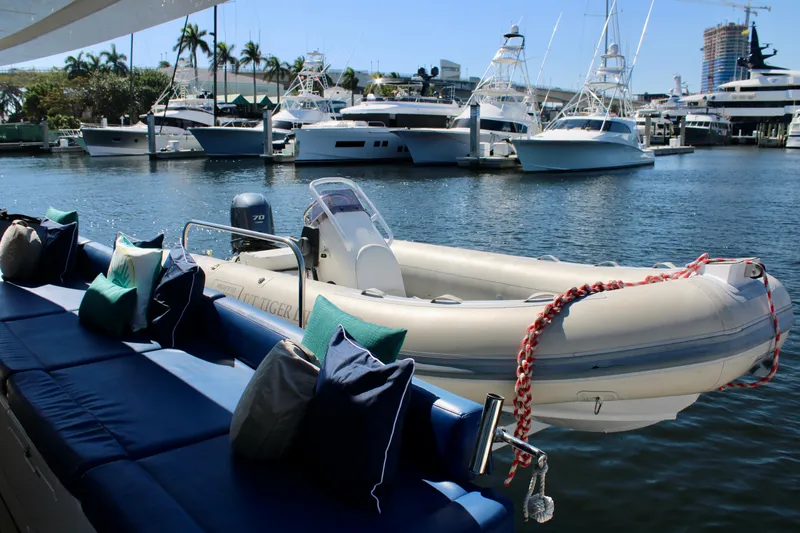 Slide: The Image of Lagoon 620 2015 yacht with tender boat docked in a marina. - 40