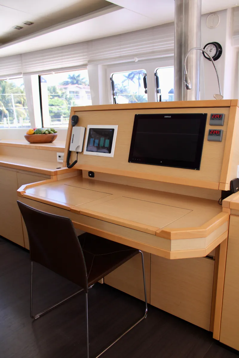 Slide: The Image of Navigation station on a 2015 Lagoon 620 catamaran with modern equipment. - 42