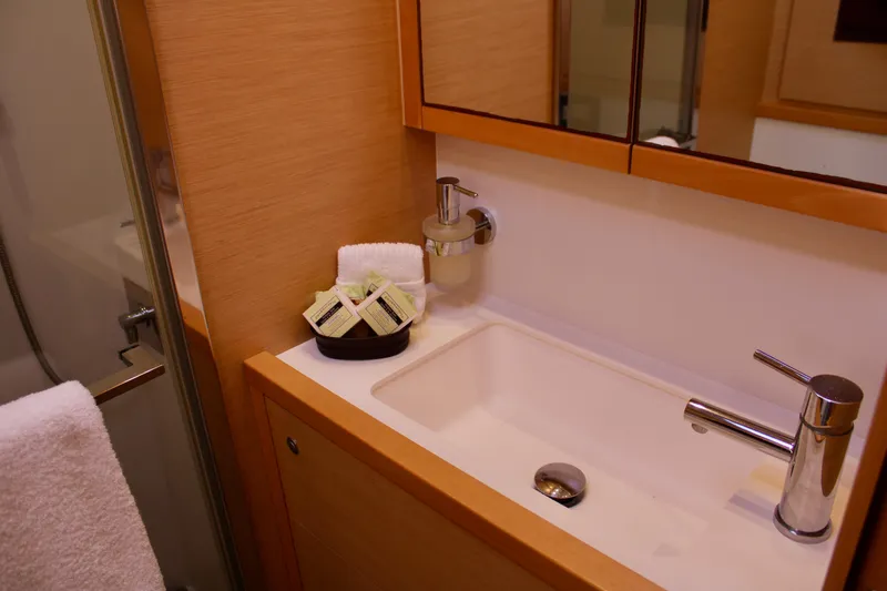Slide: The Image of Modern bathroom sink in 2015 Lagoon 620 yacht with toiletries and towel. - 43