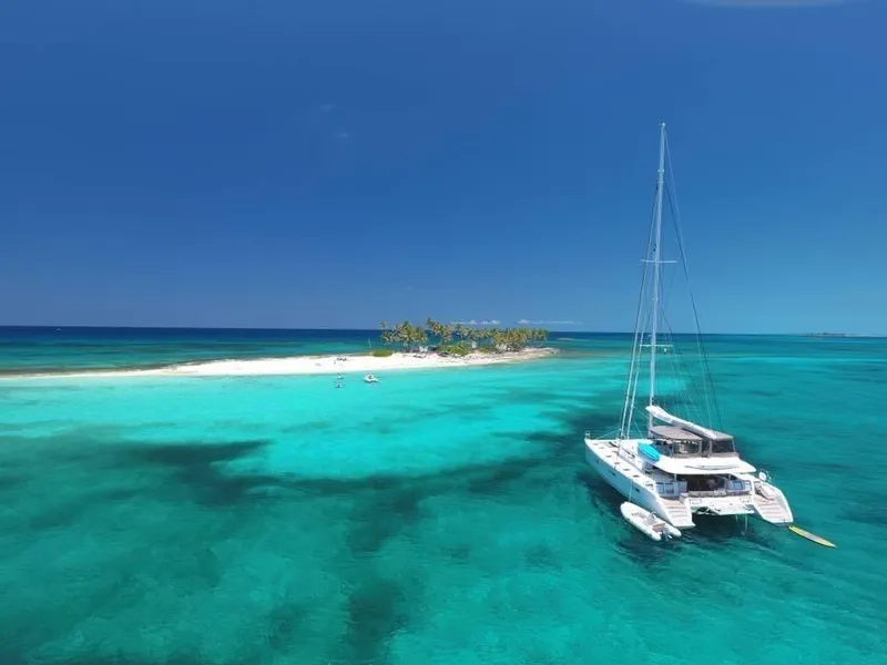 Slide: The Image of Lagoon 620 catamaran anchored near a tropical island, 2015 model. - 5