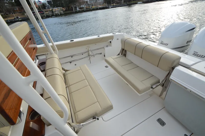 Slide: The Image of 2019 Pursuit S 288 Sport boat interior with beige seating and twin Yamaha 300 engines. - 15