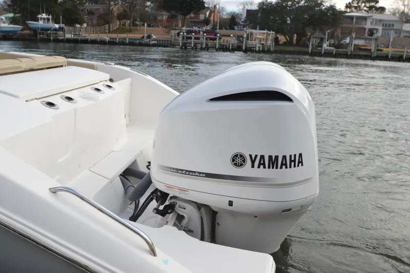 Slide: The Image of 2019 Pursuit S 288 Sport boat with Yamaha outboard motor on water. - 21