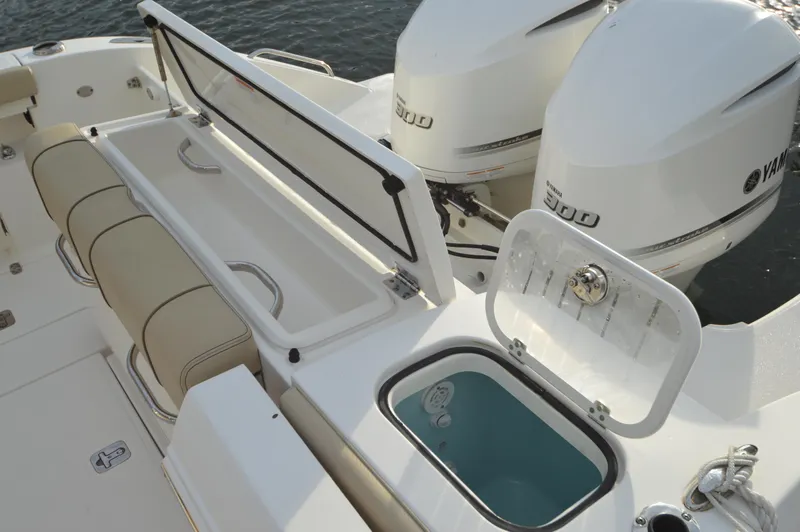 Slide: The Image of 2019 Pursuit S 288 Sport boat with Yamaha 300 engines, open storage compartments. - 25