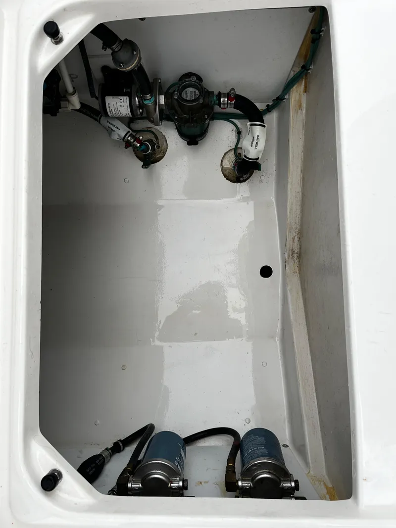 Slide: The Image of 2019 Pursuit S 288 Sport boat engine compartment with visible components. - 36