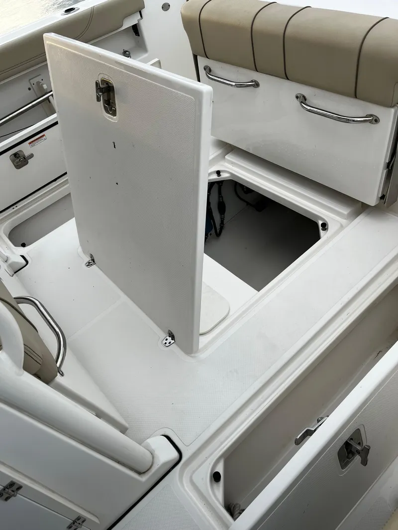 Slide: The Image of 2019 Pursuit S 288 Sport boat interior storage compartments and seating. - 38