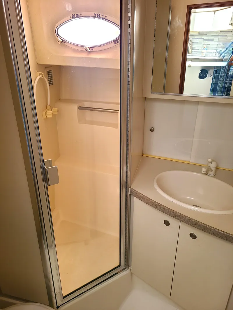 Slide: The Image of Bathroom interior of 1997 Silverton 372 Motor Yacht with shower and sink. - 13