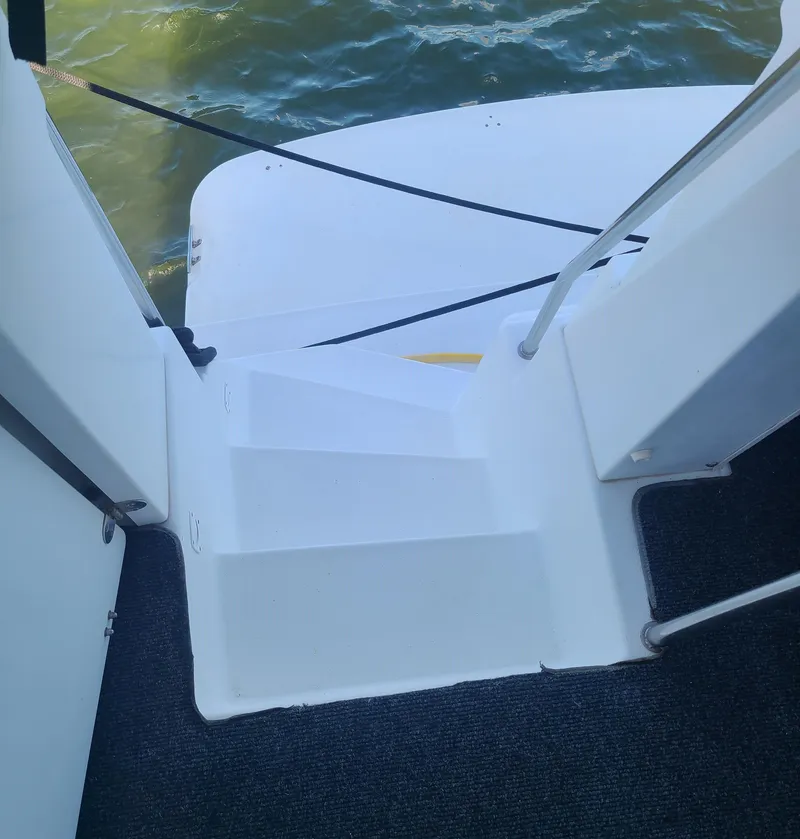Slide: The Image of Staircase on a 1997 Silverton 372 Motor Yacht leading to the water. - 18