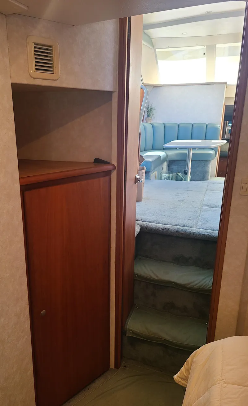 Slide: The Image of Interior view of 1997 Silverton 372 Motor Yacht, featuring stairs and seating area. - 26