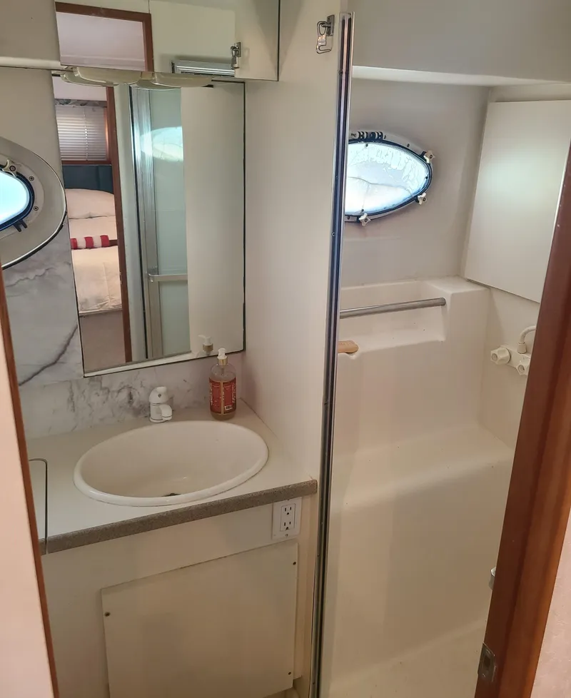 Slide: The Image of Bathroom interior of 1997 Silverton 372 Motor Yacht with sink and shower. - 6