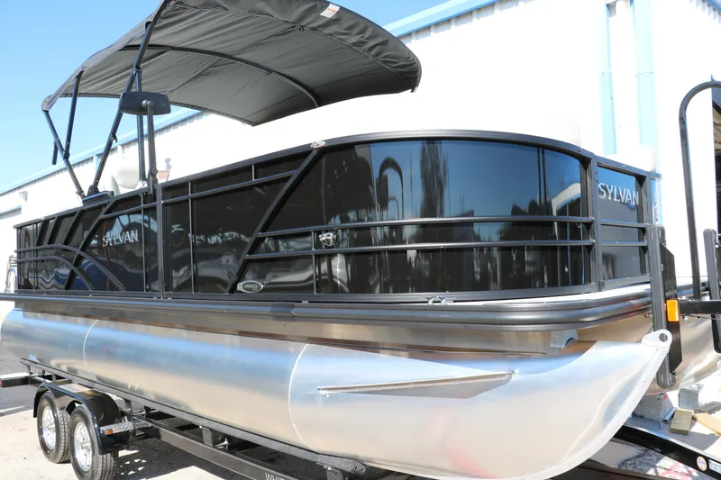Slide: The Image of 2024 Sylvan Mirage 8522 Party Fish pontoon boat with black canopy. - 11