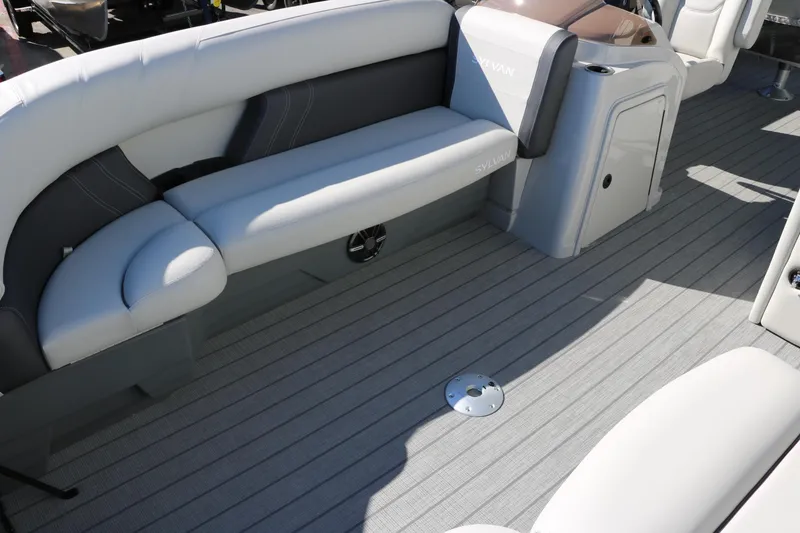 Slide: The Image of 2024 Sylvan Mirage 8522 Party Fish boat interior with gray seating and flooring. - 16