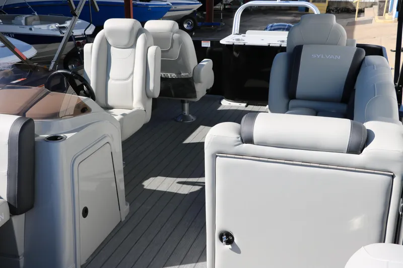 Slide: The Image of 2024 Sylvan Mirage 8522 Party Fish boat interior with luxurious seating. - 17