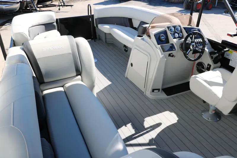Slide: The Image of 2024 Sylvan Mirage 8522 Party Fish boat interior with spacious seating and modern helm. - 20