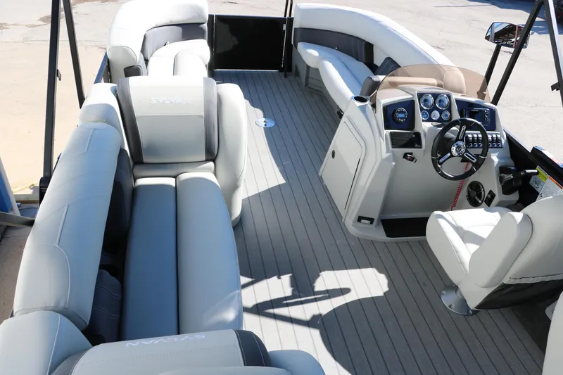 Slide: The Image of 2024 Sylvan Mirage 8522 Party Fish pontoon boat interior with spacious seating and modern helm. - 26