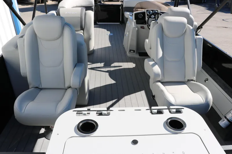 Slide: The Image of 2024 Sylvan Mirage 8522 Party Fish interior with plush seating and modern console. - 27