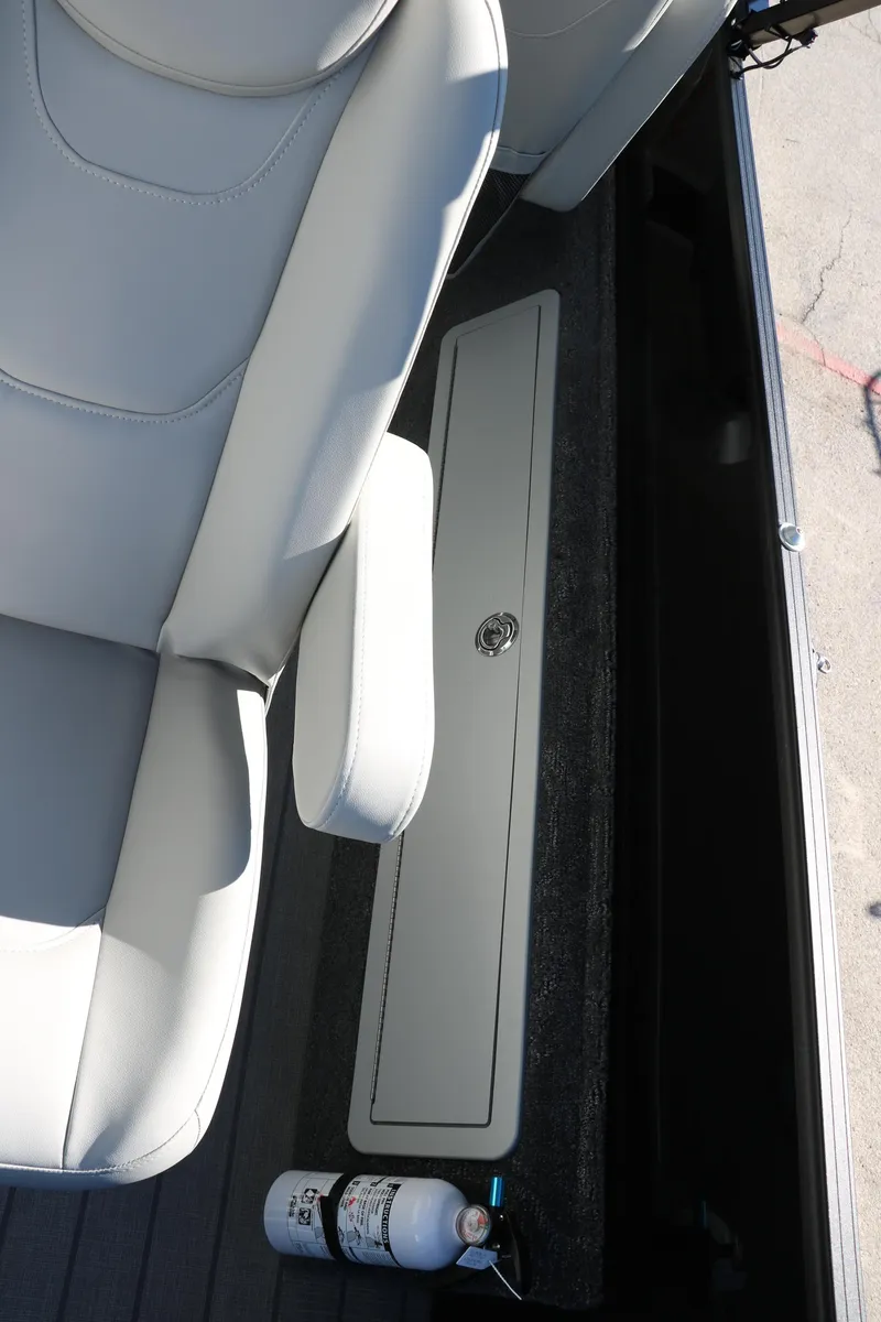 Slide: The Image of 2024 Sylvan Mirage 8522 Party Fish boat interior with storage compartment and seat. - 28