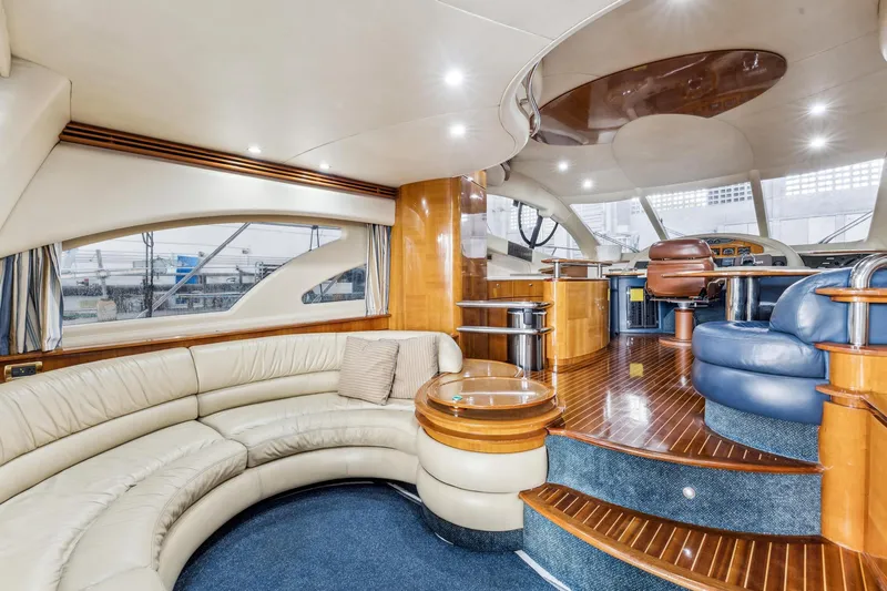 Slide: The Image of Luxurious interior of a 2005 Azimut 55 Flybridge yacht with leather seating and wooden accents. - 17