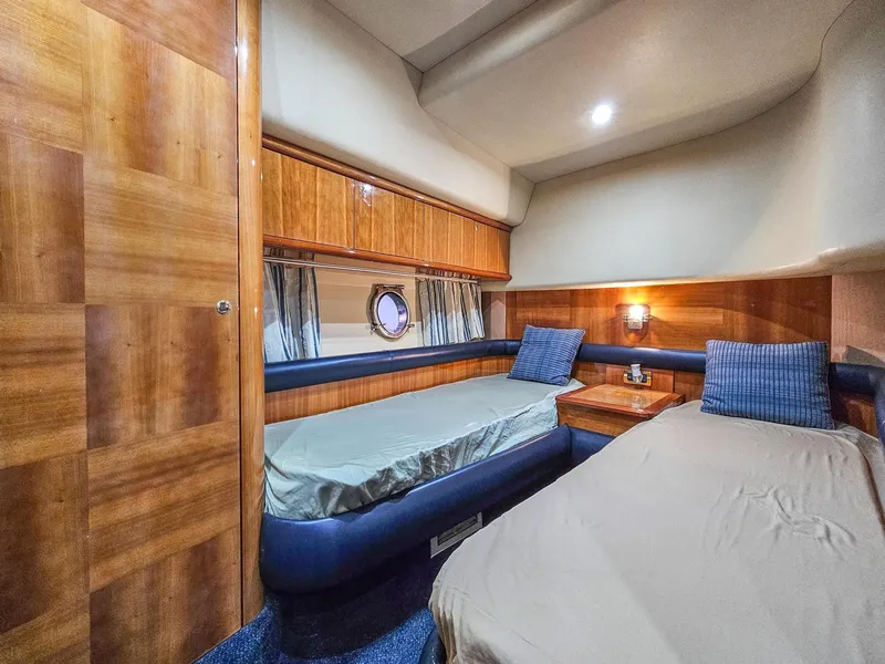 Slide: The Image of Luxurious cabin interior of 2005 Azimut 55 Flybridge yacht with twin beds. - 34
