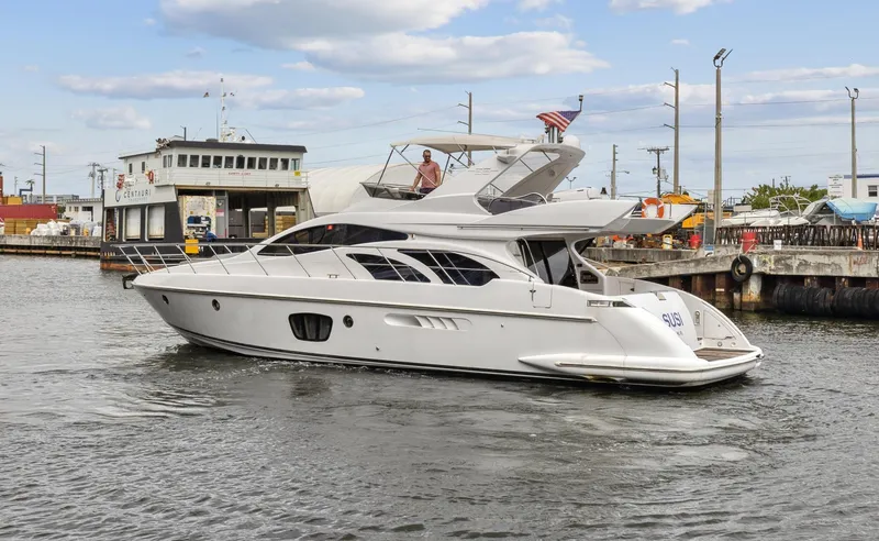 Slide: The Image of 2005 Azimut 55 Flybridge yacht cruising in a harbor. - 4