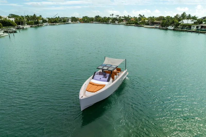 Slide: The Image of 2017 Fjord 40 Open yacht cruising in a serene, tropical bay. - 18