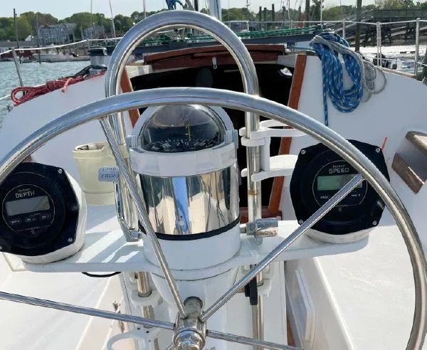 Slide: The Image of Cockpit of 1988 Catalina 30 MkII sailboat with steering wheel and navigation instruments. - 12