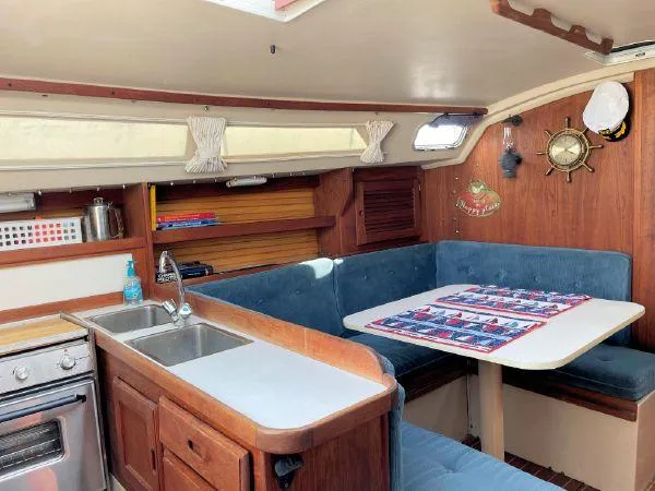 Slide: The Image of Interior of 1988 Catalina 30 MkII sailboat with kitchen and dining area. - 15