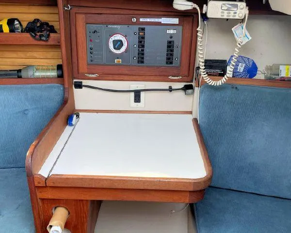 Slide: The Image of Navigation station inside a 1988 Catalina 30 MkII sailboat with control panel and radio. - 22