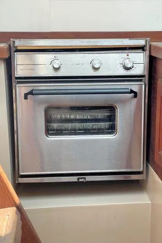 Slide: The Image of Stainless steel oven in a 1988 Catalina 30 MkII yacht kitchen. - 24