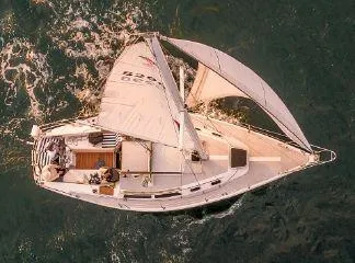 Slide: The Image of Aerial view of 1988 Catalina 30 MkII sailboat navigating through water. - 25