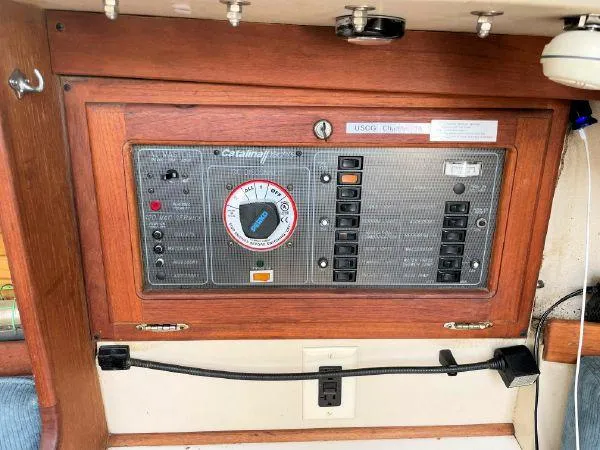 Slide: The Image of Electrical panel of a 1988 Catalina 30 MkII sailboat with switches and dials. - 7