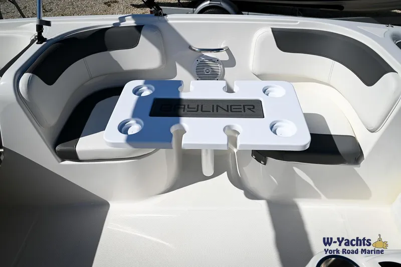Slide: The Image of 2023 Bayliner E18 boat interior with seating and table, W-Yachts York Road Marine. - 16