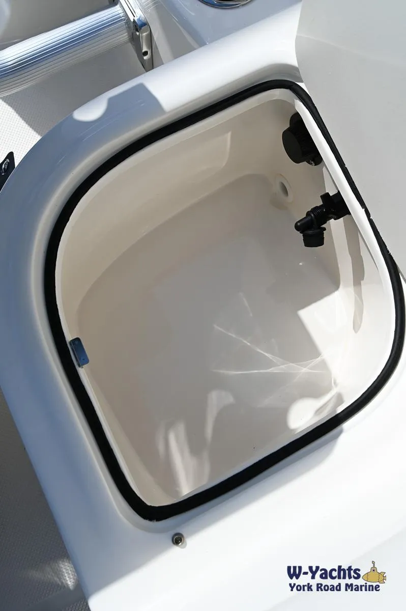 Slide: The Image of 2023 Bayliner E18 storage compartment on deck. - 19