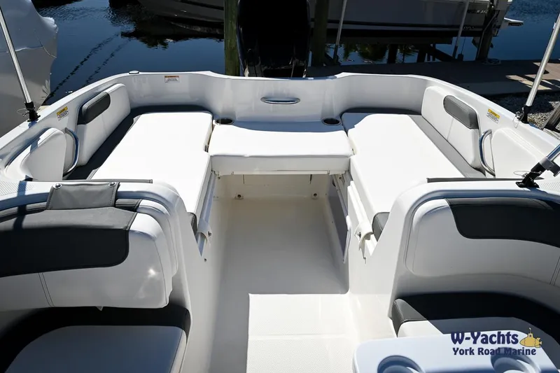 Slide: The Image of 2023 Bayliner E18 boat interior with spacious seating and modern design. - 5