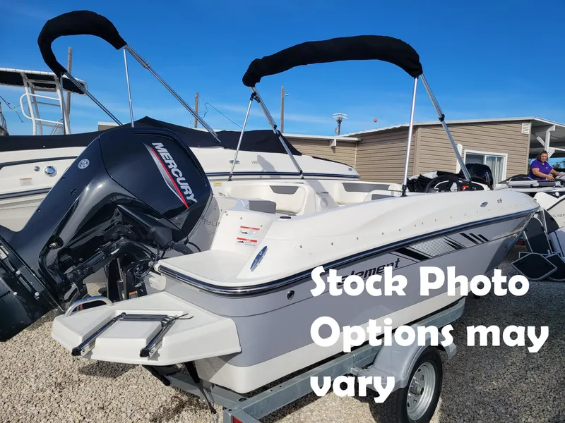 The Image of 2023 Bayliner E18 boat with Mercury outboard engine on trailer. - 1