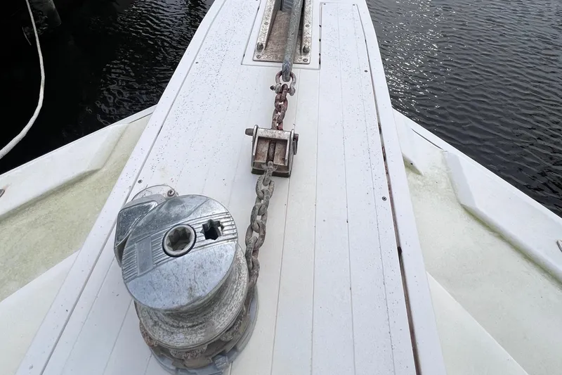 Slide: The Image of Bow of 1988 Bertram 43 Convertible with anchor chain and winch. - 15