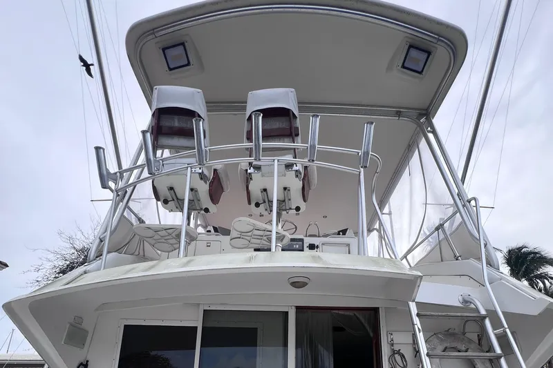 Slide: The Image of 1988 Bertram 43 Convertible boat with flybridge and dual captain chairs. - 16