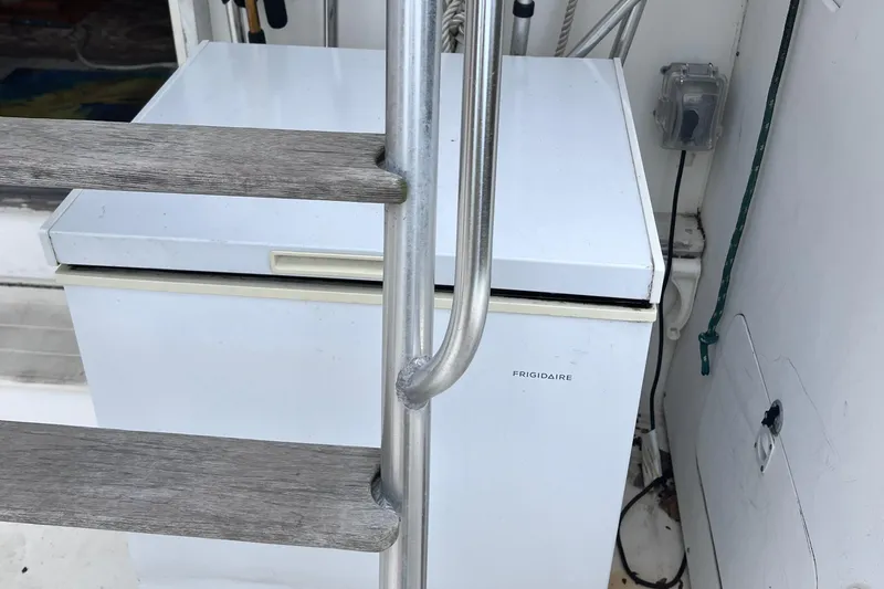 Slide: The Image of White Frigidaire refrigerator on a 1988 Bertram 43 Convertible boat. - 18