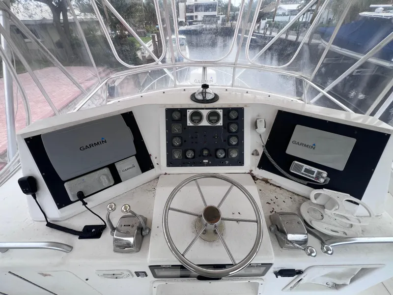 Slide: The Image of 1988 Bertram 43 Convertible boat helm with Garmin navigation systems. - 24