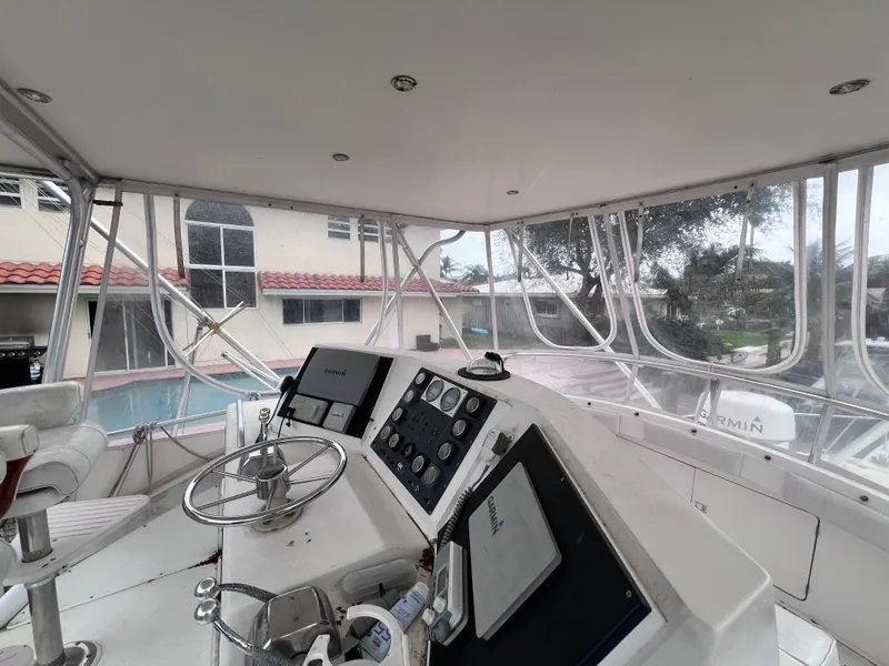 Slide: The Image of Cockpit view of a 1988 Bertram 43 Convertible yacht with navigation equipment. - 28