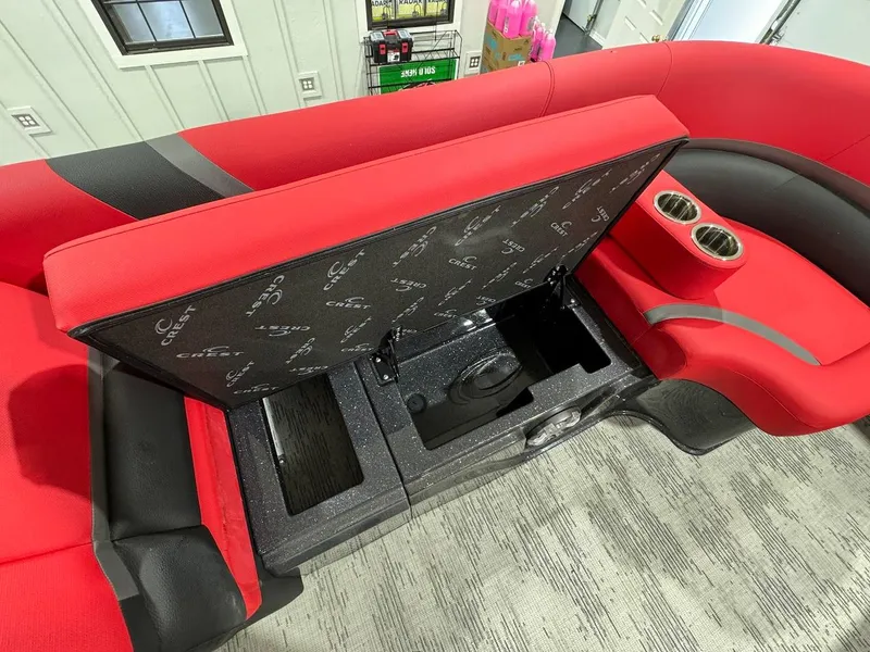 Slide: The Image of 2024 Crest Caribbean RS 230 SLRC pontoon boat on trailer in showroom. - 19