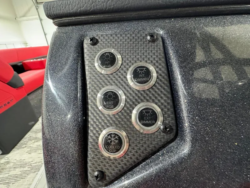 Slide: The Image of 2024 Crest Caribbean RS 230 SLRC boat interior with vibrant red seating and modern helm. - 23