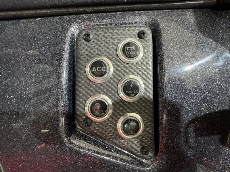 Slide: The Image of 2024 Crest Caribbean RS 230 SLRC boat interior with red seating and storage drawers. - 24