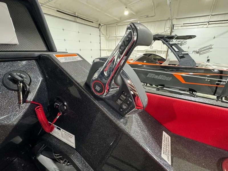 Slide: The Image of 2024 Crest Caribbean RS 230 SLRC boat with luxurious red seating. - 25