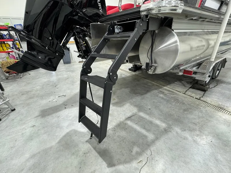 Slide: The Image of 2024 Crest Caribbean RS 230 SLRC interior with red and black seating in showroom. - 29