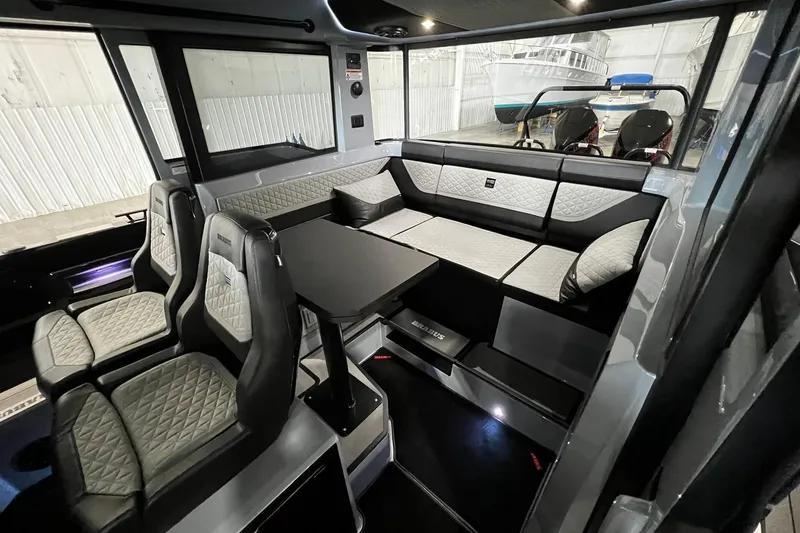 Slide: The Image of Luxurious interior of 2024 BRABUS Shadow 1000XC boat with quilted seating and sleek design. - 11