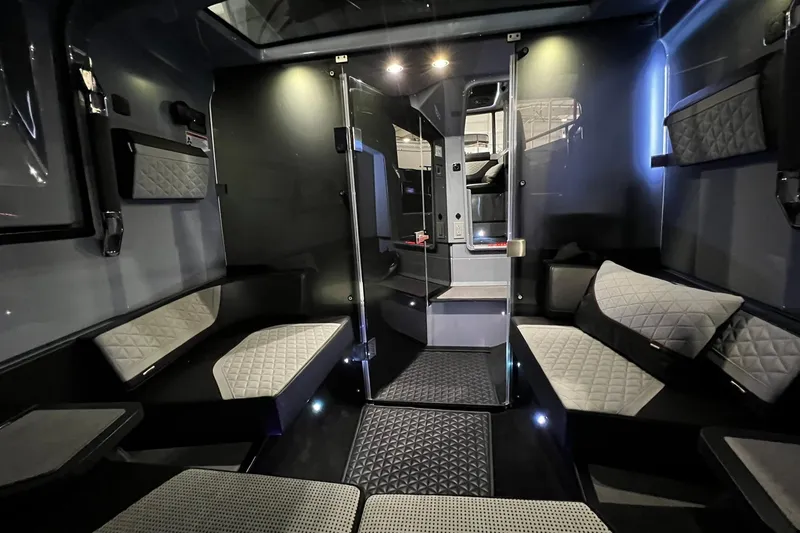 Slide: The Image of Luxurious interior of 2024 BRABUS Shadow 1000XC with modern seating and ambient lighting. - 16