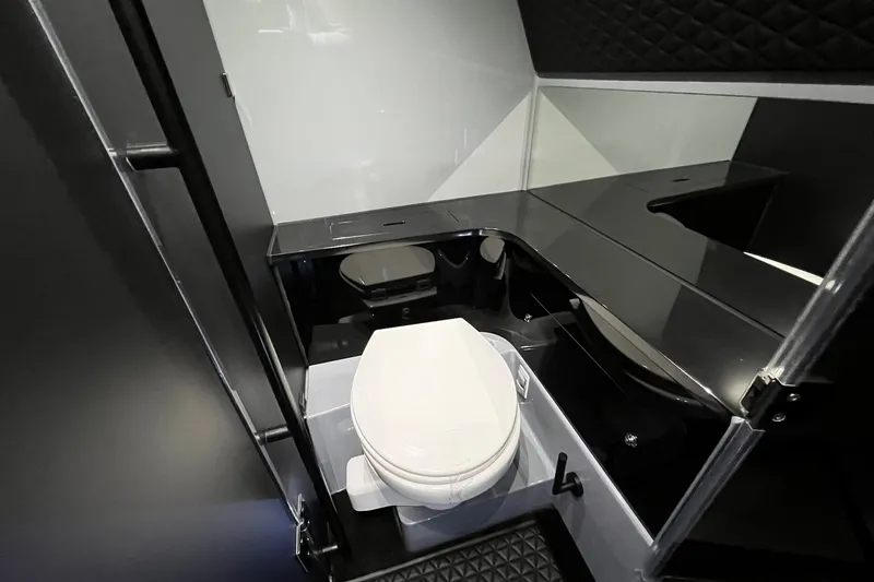 Slide: The Image of Luxurious bathroom interior of 2024 BRABUS Shadow 1000XC with sleek black and white design. - 17
