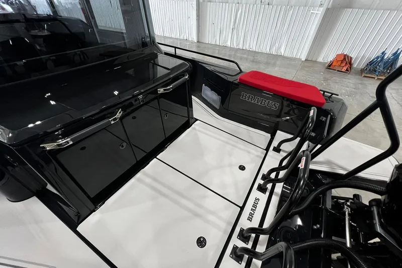 Slide: The Image of 2024 BRABUS Shadow 1000XC boat interior with sleek black and red design elements. - 2