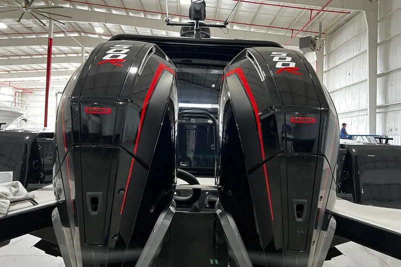 Slide: The Image of 2024 BRABUS Shadow 1000XC boat engines in a warehouse setting. - 20